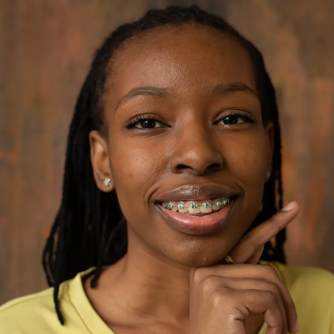 Teenage patient smiling with braces at Superior Orthodontics in Metro Detroit, MI